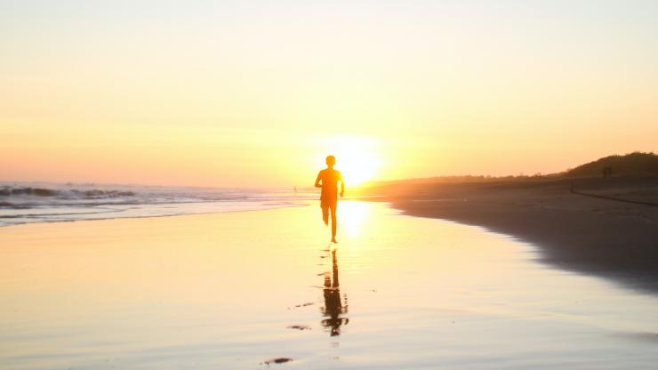 man running on beach